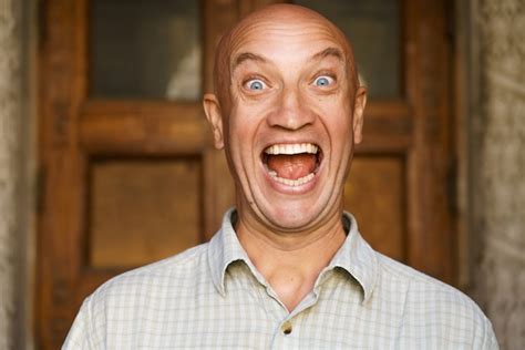 premium photo portrait of an emotional bald guy with blue eyes dressed in light shirt shows