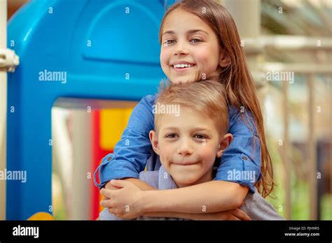 portrait of a cute siblings having fun together on playground brother and sister with pleasure