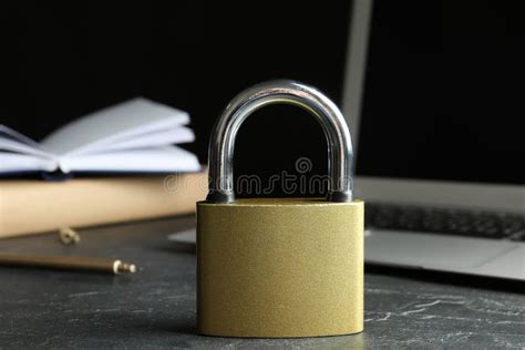 Metal Lock And Laptop On Grey Table Protection From Cyber Attack Stock