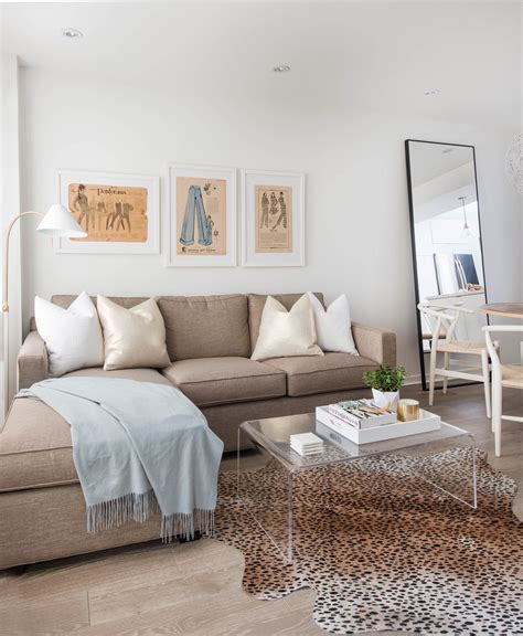 Neutral Living Space Featuring L Shape Sectional Couch And Statement