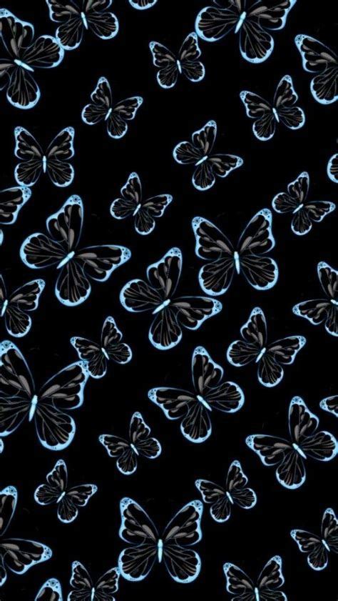 Many Pink Butterflies Are Flying In The Air On A Black Background With