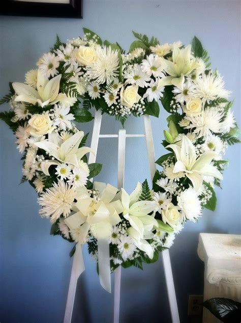 Beautiful All White Heart Shaped Easel Spray With Lilies Roses