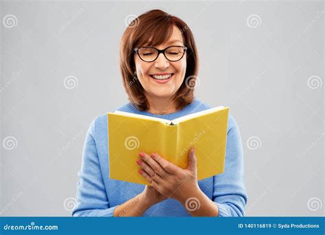 Portrait Of Senior Woman In Glasses Reading Book Stock Image Image Of