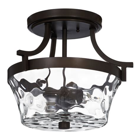 A wire cage shade, simple housing, and antique bronze finish make the warehouse of tiffany edison kinsey ld4224 semi flush mount light an industrial chic beauty. allen + roth Latchbury 14.33-in W Aged Bronze Textured ...