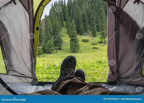Man Is Laying In Tent In Beautiful Mountains Camping In Mountains