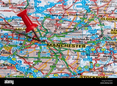 Red Map Pin In Road Map Pointing To City Of Manchester Stock Photo