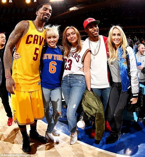 Miley Cyrus Takes The Spotlight At New York Knicks Game With Sister