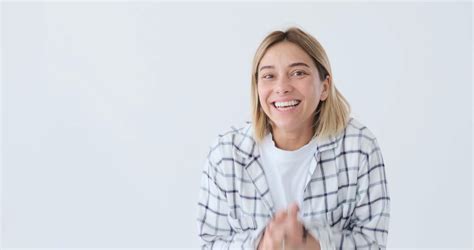 Excited Woman Laughing Over White Background Stock Video Footage 0011