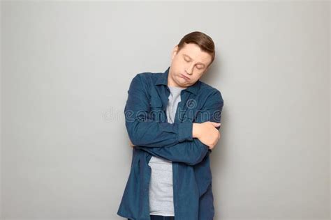 Studio Portrait Of Tired Bored Mature Man Puffing Cheeks Stock Image