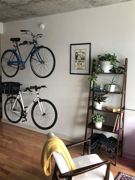 Ceiling bike racks are a wonderful way for urban bicycle owners to continue to be able to take their bikes out when they feel like it without having to deal with their bikes taking up valuable room in their cramped apartments. simple-diy-bike-rack-in-living-room
