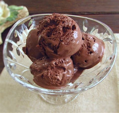 In small white bowls on white grey stone table copy space. Chocolate ice cream | Food From Portugal