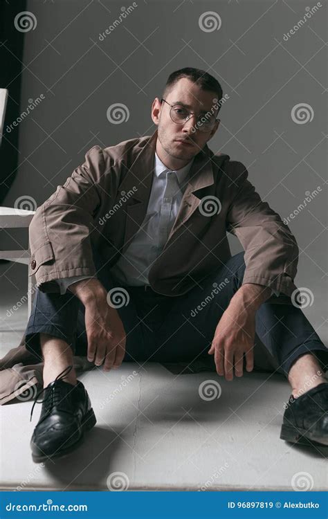 A Lonely Handsome Guy In A Raincoat And Glasses With Different Moods