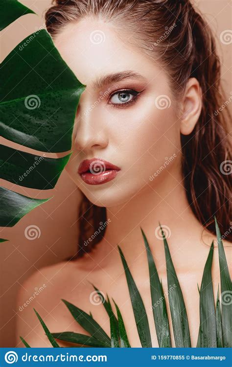 Portrait Of Young And Beautiful Woman In Tropical Leaves Stock Image Image Of Antiaging