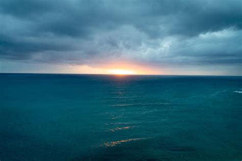 Blue Sea At Sunrise Photo Free Sky Image On Unsplash