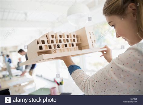 Female Architect Examining Architectural Model Stock Photo Alamy
