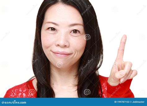 Middle Aged Japanese Woman Presenting And Showing Something Stock Image Image Of Pointing