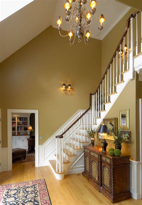 The Elegant Lighting Warm Paint Color And Bend Of This Staircase