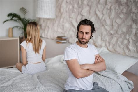 Premium Photo Unhappy Young Couple Having Relationship Problems Sitting On Opposite Sides Of