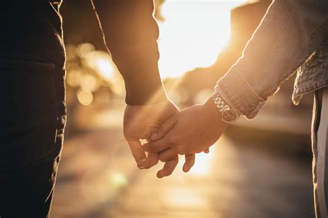 Man And Woman Holding Hands Stock Photo Download Image Now Istock