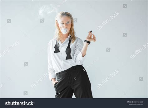 Attractive Stylish Blonde Girl Smoking Cigar Stock Photo 1231584268