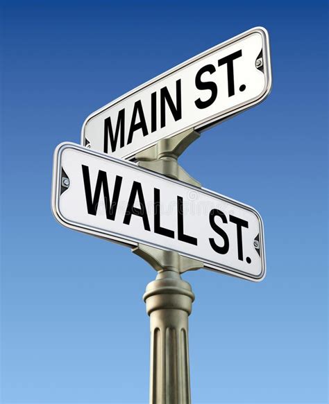 Two Street Signs That Read Main St And Wall St On Top Of Each Other In