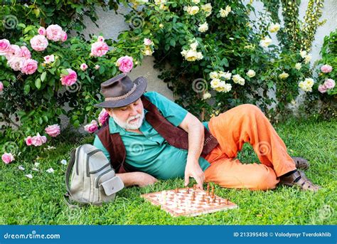 Old Man Play Chess Outdoor Nursing Home Mature Man Relax In Garden
