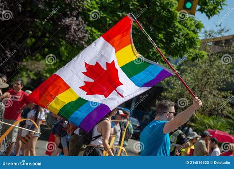 Man Holding A Canadian Rainbow Flag At Vancouver Gay Pride Parade 2019 Bristish Columbia Canada