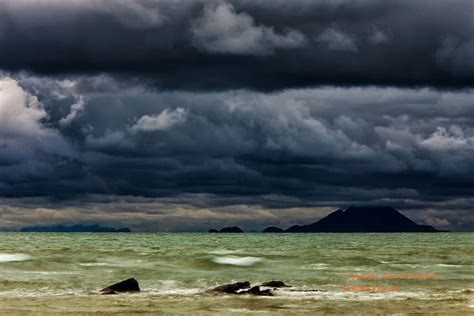 Ominous Storm Clouds Over An Emerald Green Pacific Ocean Ko Lanta