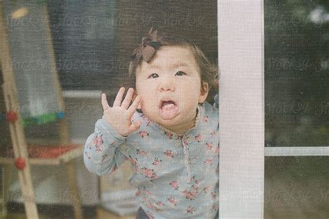 Baby Pressing Face Against Screen By Stocksy Contributor Lauren Lee