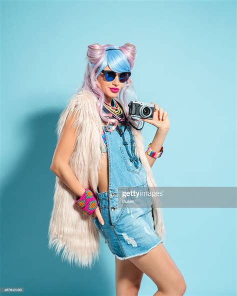 Pink Hair Girl In Funky Manga Outfit Holding Camera High Res Stock