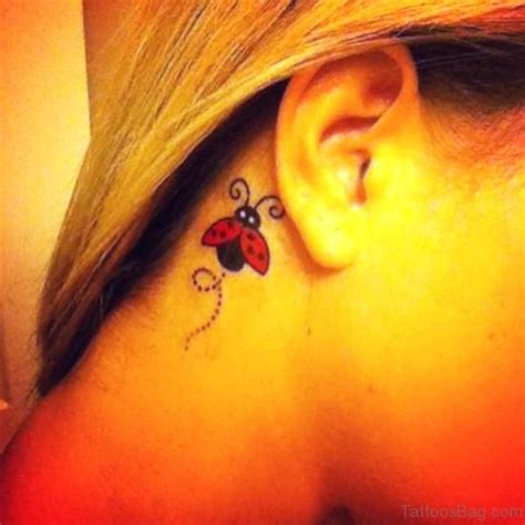 16 Attractive Ladybug Tattoos Behind Ears