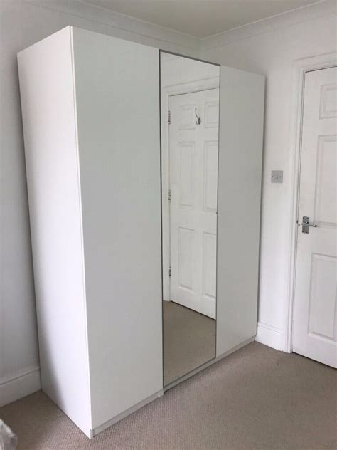 99.8x60.2x201.2 cm white/vikedal mirror glass. White Ikea PAX wardrobe with three doors (one mirror door ...