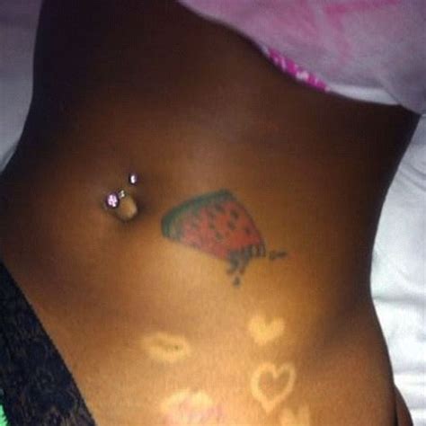 Take a look through the tattoos of blac chyna with their meaning. Blac Chyna Watermelon Stomach Tattoo | Steal Her Style