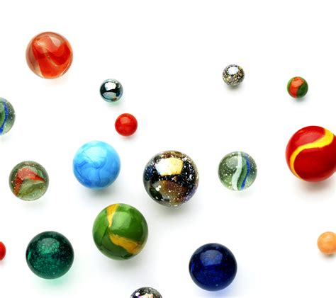 Marble Toy Collection On White Surface Hd Wallpaper Wallpaper Flare