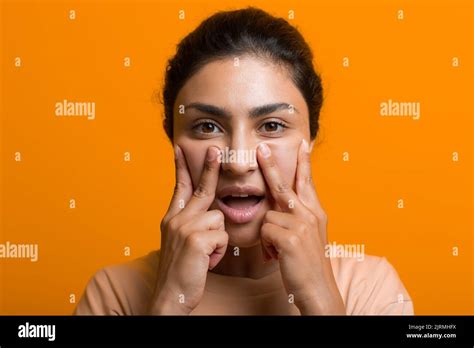 Close Up Portrait Of Young Indian American Woman Doing Facebuilding