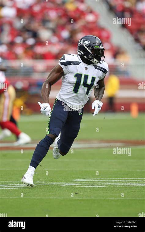 seattle seahawks wide receiver dk metcalf 14 runs a route during an nfl football game against