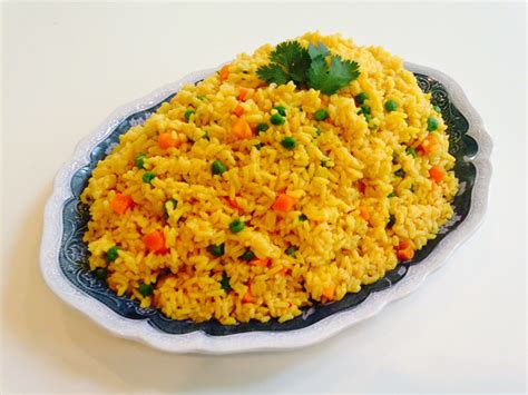 Check the rice to determine if it is finished cooking. Sofie's Kitchen: Cinco De Mayo Vegetarian Yellow Rice with ...