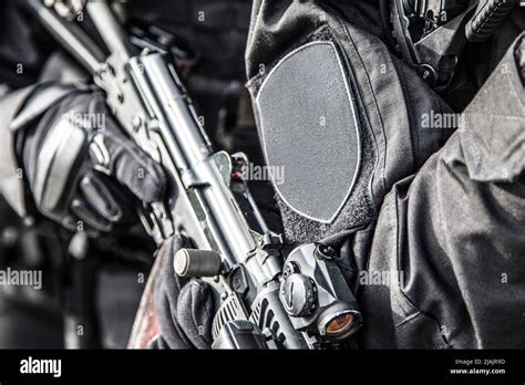 Swat Team Members Armed With Service Rifles Standing In Stack