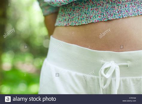 Young Womans Abdomen Mid Section Stock Photo Alamy