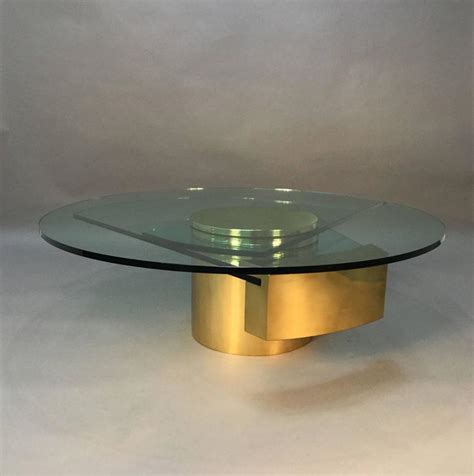 Dakota model coffee table, metal structure and glass top. Dakota Jackson Self Winding Brass and Glass Coffee Table ...