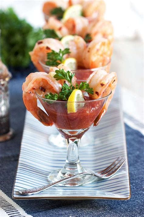 Shrimp Cocktail Served In Martini Glasses With Garnishes