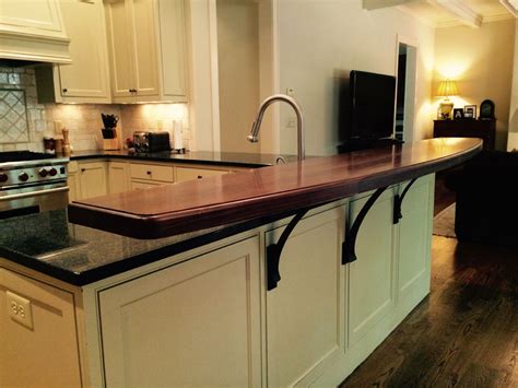 This type of raised bar is a countertop that sits above the height of the base cabinets by 6 inches and is 18 inches in depth. Raised Bar Tops - J. Aaron