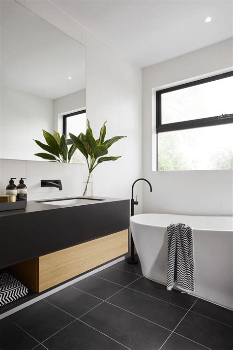 Modern black and white bathroom tiles.black and white are two colors that are meant to be together. Dream Home: The Langham 44 by Carter Grange. cartergrange ...