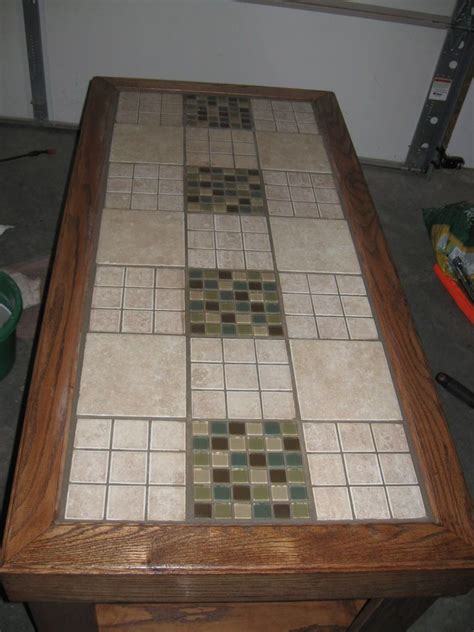 Having a ceramic, porcelain, or granite material inlaid in your table means you do not need to use a table pad or place mats to protect the surface. Tile a Table Top | Diy table top, Tile top tables, Tile tables