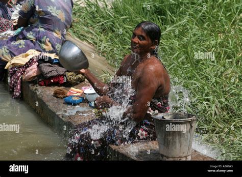 Woman Bathing In The Rural Countryside Of Sri Lanka Stock Photo Alamy