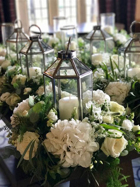 Lanterns In Rings Flower Centerpieces Wedding