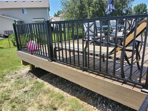 This core is then encased in a synthetic shell on three sides, which protects it from the elements and offers resistance to fading, scratches, or developing mould or mildew. Trex Decking and Trex Signature Aluminum Rail | Deck and Drive Solutions - Iowa Deck Builder