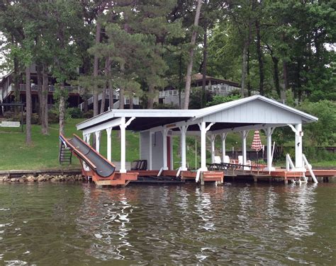 A Dock With A Slide Lakefront Living House Lake House