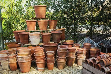 A Large Stack Of Terracotta Pots In A Garden Stock Photo Dissolve