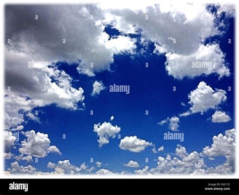 Blue Sky With Puffy White Clouds Stock Photo Alamy